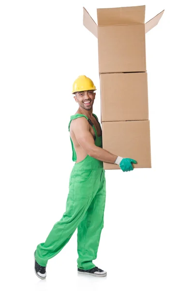 Hombre en mono verde con cajas — Foto de Stock