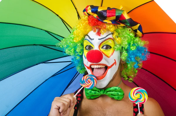 Clown con ombrellone e lecca-lecca — Foto Stock