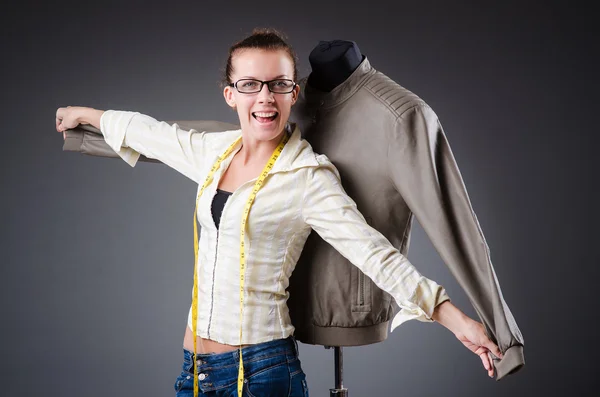 Woman tailor working on clothing — Stock Photo, Image