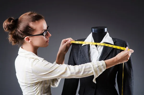 Woman tailor working on clothing — Stock Photo, Image