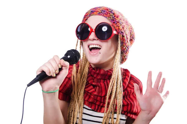 Young female singer with mic on white — Stock Photo, Image