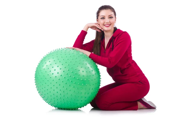 Young woman with ball exercising on whitee — Stock Photo, Image