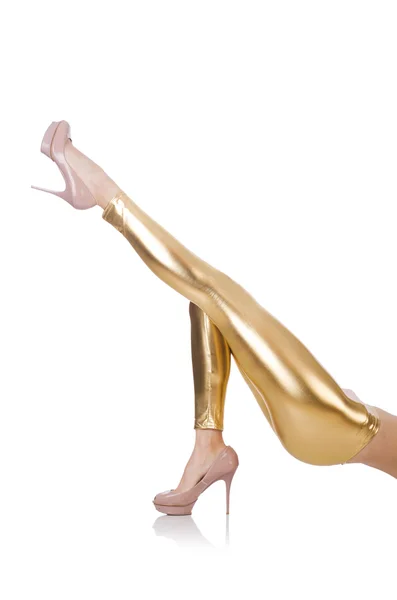 Kvinnebein med gullstrømper – stockfoto