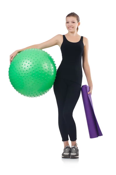 Young woman with ball exercising on whitee — Stock Photo, Image