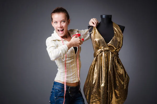 Woman tailor working on clothing — Stock Photo, Image