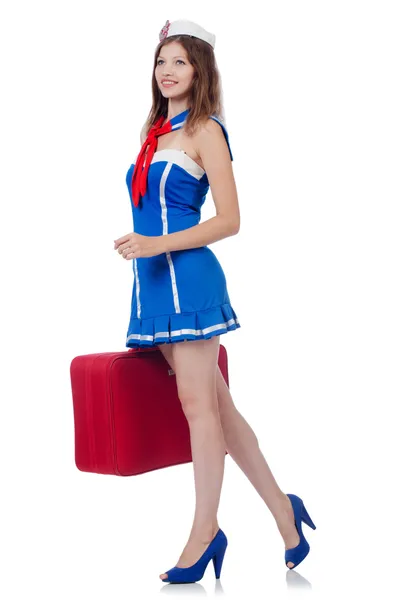 Žena cestovní asistentka s kufrem na bílém — Stock fotografie