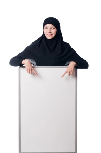 Muslim woman with blank board on white — Stock Photo, Image