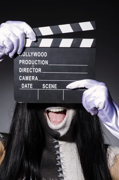 Scary monster with movie board — Stock Photo, Image