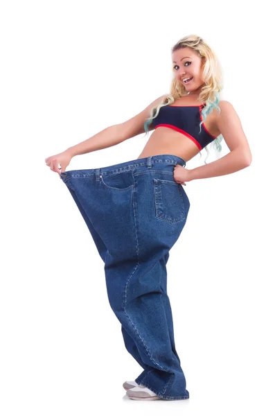 Woman in dieting concept with big jeans — Stock Photo, Image