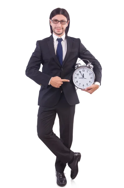 Jeune homme d'affaires avec horloge sur blanc — Photo