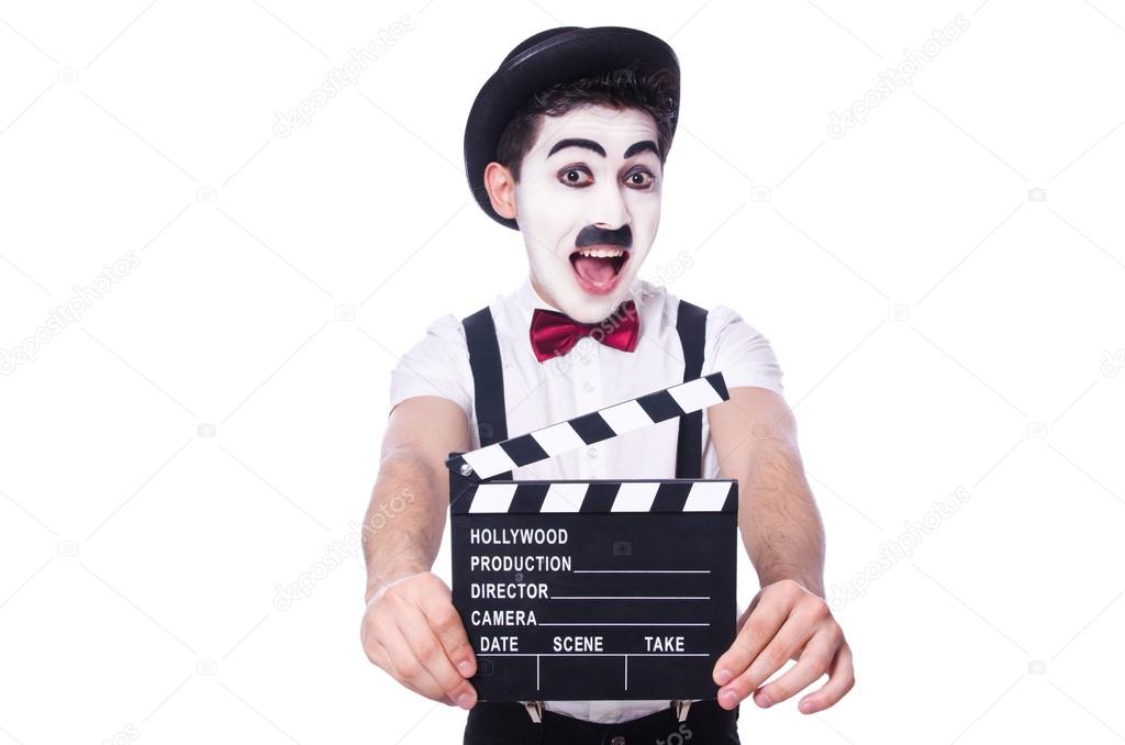 Man with movie clapper isolated on white