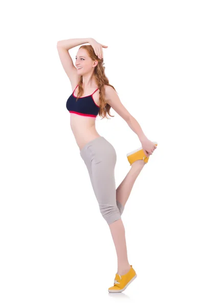 Młoda kobieta robi ćwiczenia na białym — Zdjęcie stockowe