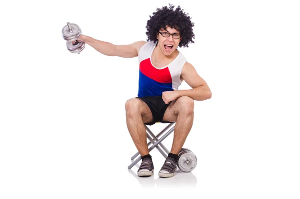 Hombre divertido haciendo ejercicio con pesas — Foto de Stock