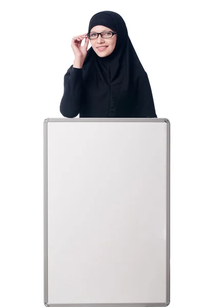 Muslim woman with blank board on white — Stock Photo, Image