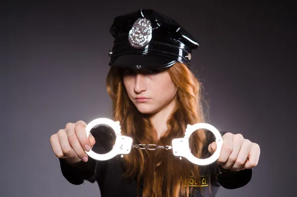 Woman police office in dark room — Stock Photo, Image