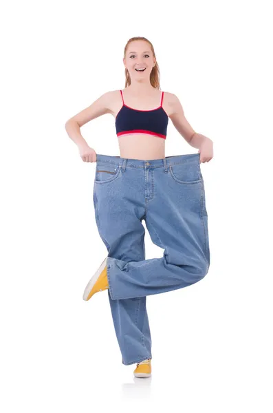 Woman with large jeans in dieting concept — Stock Photo, Image