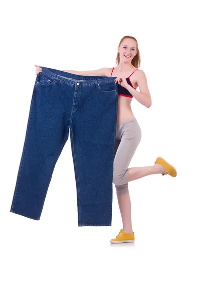 Woman with large jeans in dieting concept — Stock Photo, Image