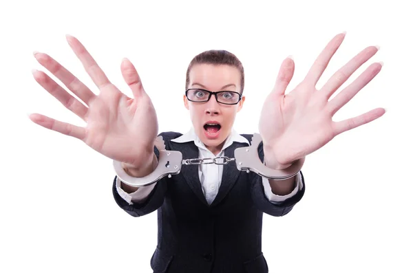 Female businesswoman with handcuffs on white — Stock Photo, Image