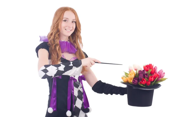 Magician woman with flowers on white — Stock Photo, Image