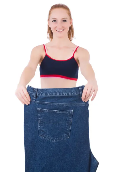 Woman with large jeans in dieting concept — Stock Photo, Image