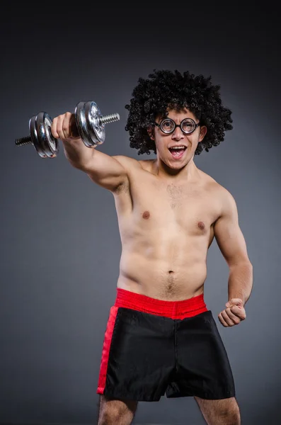 Funny man exercising with dumbbells — Stock Photo, Image