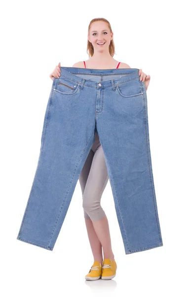 Woman with large jeans in dieting concept — Stock Photo, Image