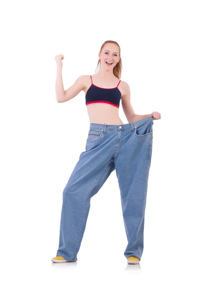 Woman with large jeans in dieting concept — Stock Photo, Image