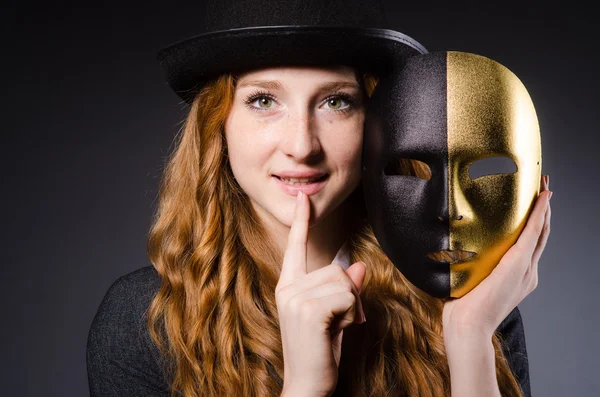 Woman with mask in hypocrisy concept — Stock Photo, Image