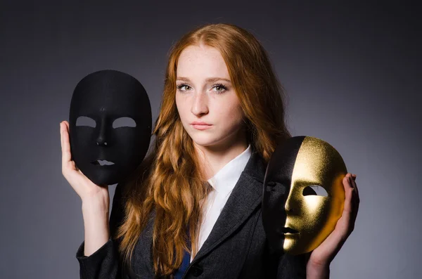 Woman with mask in hypocrisy concept — Stock Photo, Image