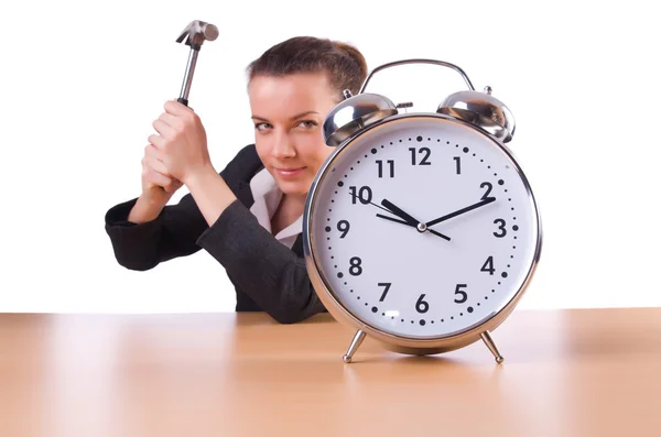 Woman trying to break the clock — Stock Photo, Image