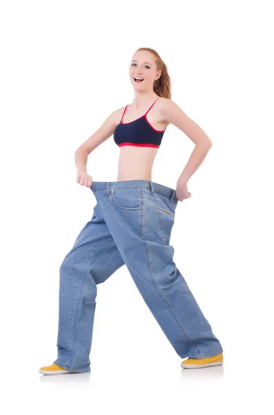 Woman with large jeans in dieting concept — Stock Photo, Image