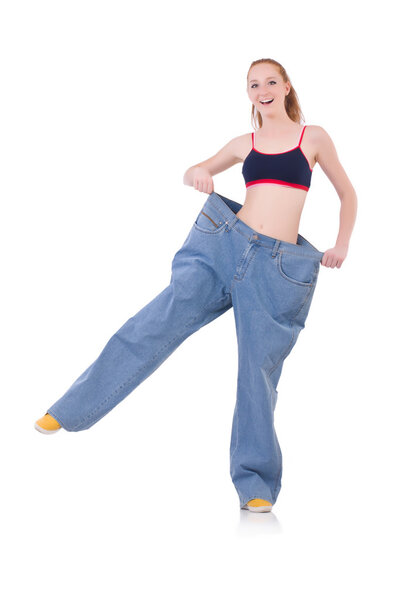 Woman with large jeans in dieting concept