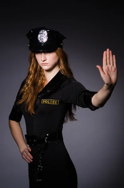Woman police office in dark room — Stock Photo, Image
