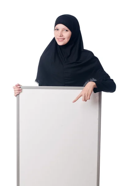 Muslim woman with blank board on white — Stock Photo, Image