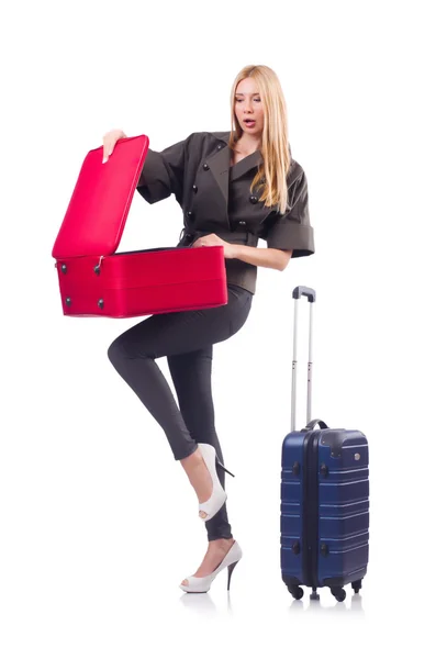 Mujer preparándose para las vacaciones con maleta en blanco —  Fotos de Stock