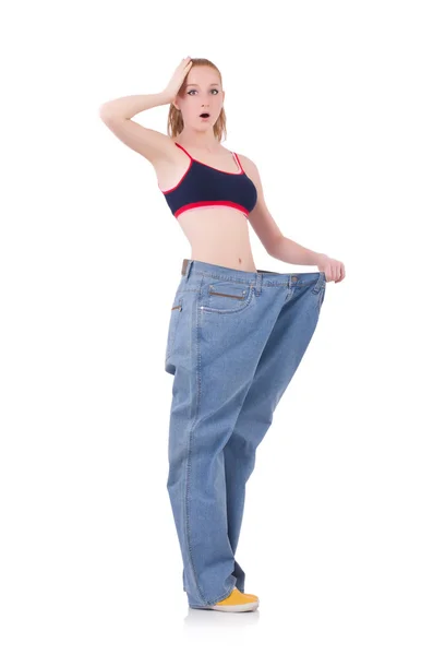Woman with large jeans in dieting concept — Stock Photo, Image