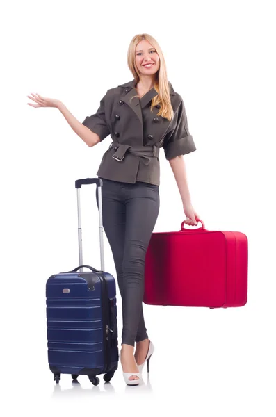 Kvinna förbereder sig för semester med resväska på vitt — Stockfoto