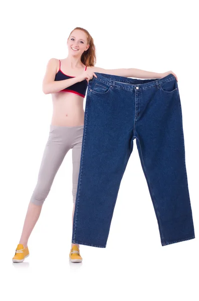 Woman with large jeans in dieting concept — Stock Photo, Image