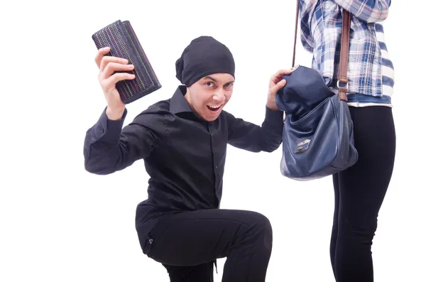 Young thief stealing woman's bag — Stock Photo, Image