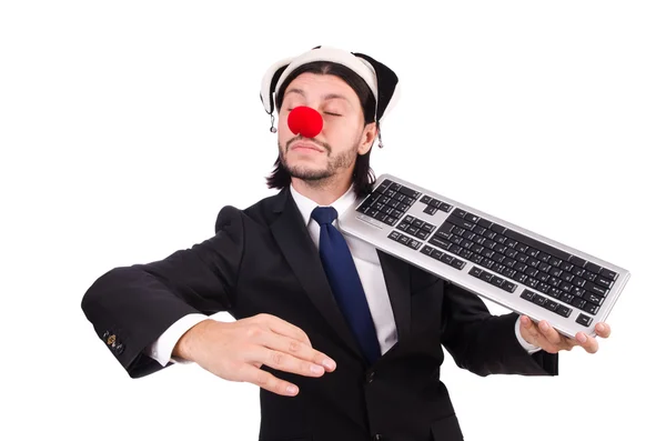 Lustiger Clown mit Tastatur isoliert auf weiß — Stockfoto