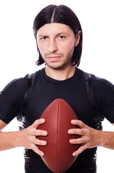 Uomo di formazione con il calcio americano su bianco — Foto Stock