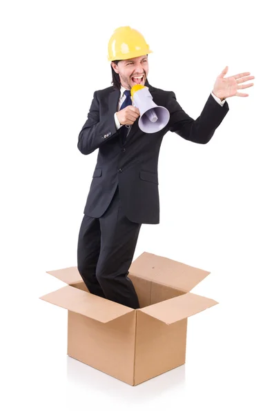 Hombre con casco y altavoz de pie en la caja — Foto de Stock