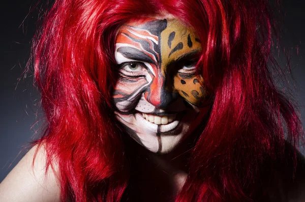 Woman with face painting in dark room — Stock Photo, Image