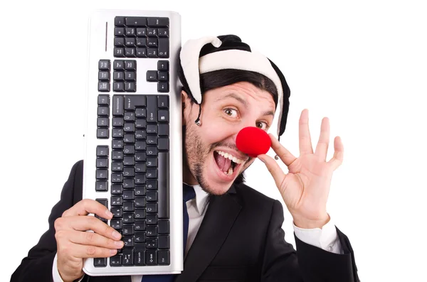 Funny clown with keyboard isolated on white — Stock Photo, Image