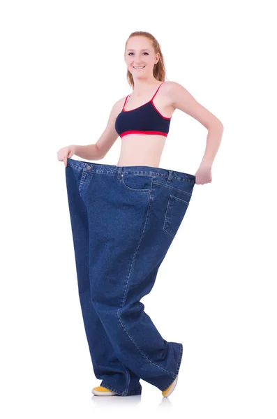 Woman with large jeans in dieting concept — Stock Photo, Image