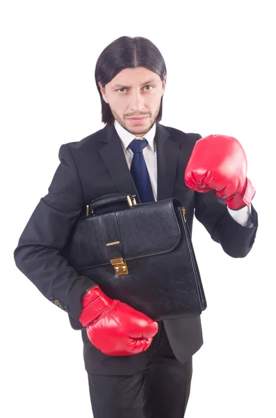 Uomo d'affari con guanti da boxe su bianco — Foto Stock