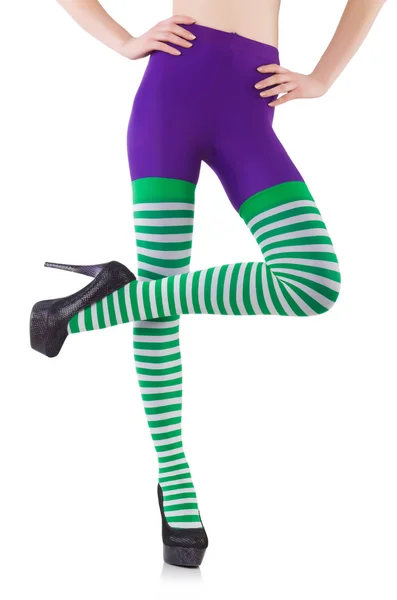 Woman legs in striped leggings — Stock Photo, Image
