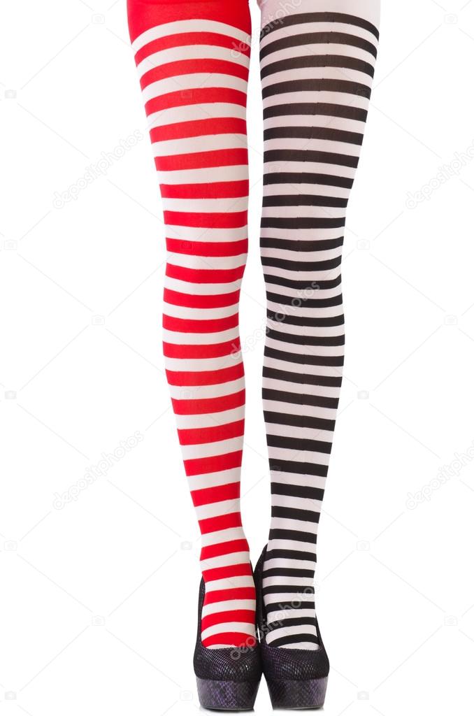 Woman legs in striped leggings