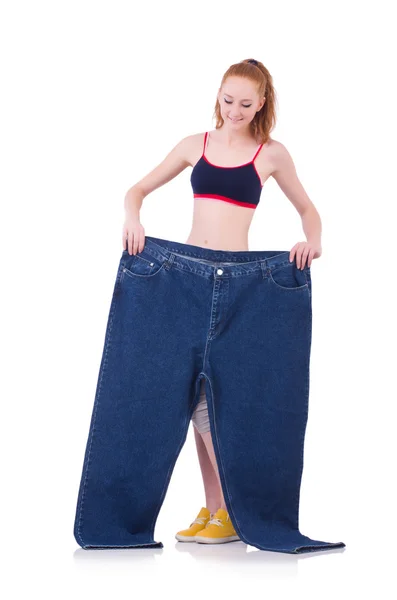穿着大牛仔裤的女性节食观念 — 图库照片