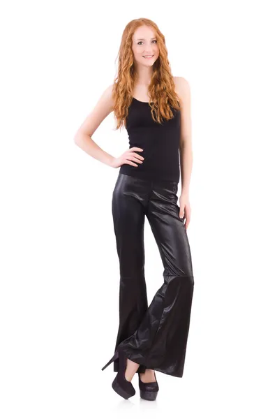 Redhead woman in black bell bottom pants on white — Stock Photo, Image